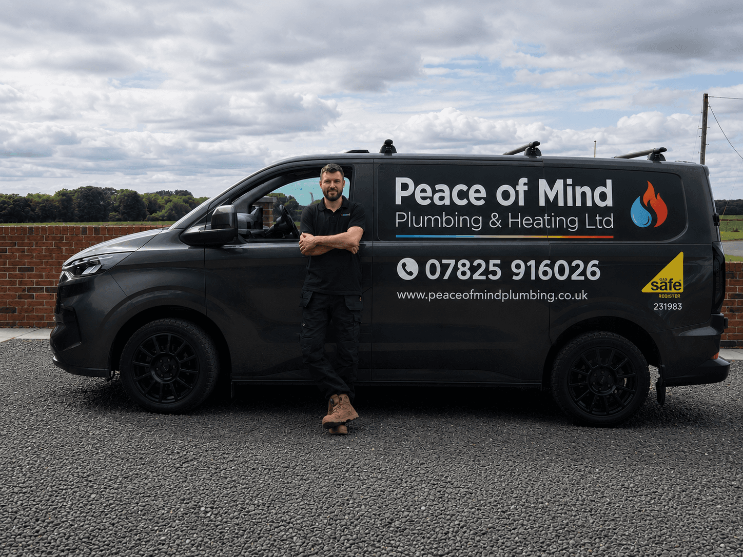 Peace of Mind Plumbing & Heating engineer beside the branded van